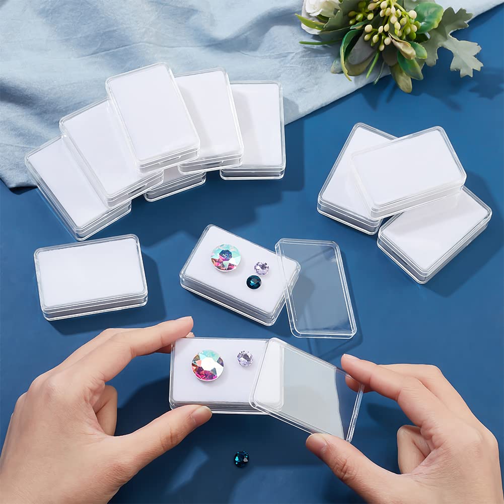 NBEADS 12 Pcs Gemstone Display Box, 1.45x2.24x0.6 Transparent Acrylic Rectangle Jewelry Display Container Diamond Storage Box with Clear Top Lids and White Sponge for Bare Stone Diamond