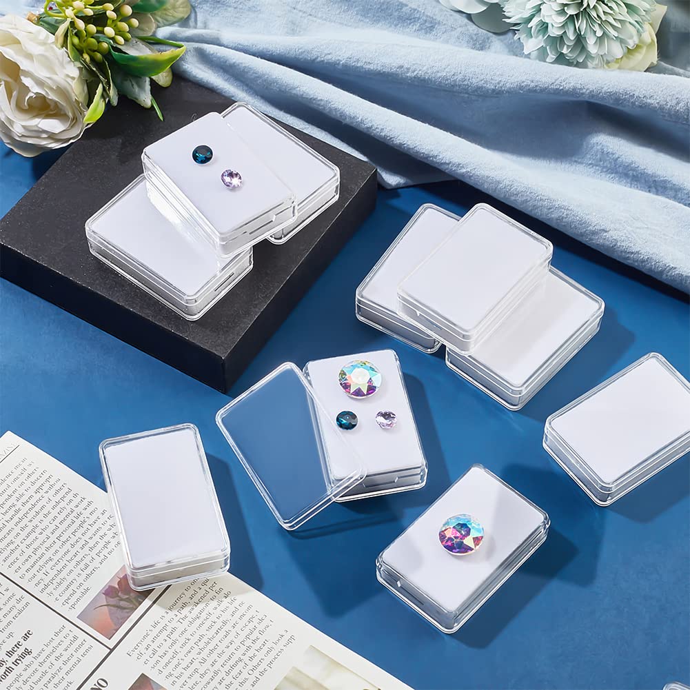 NBEADS 12 Pcs Gemstone Display Box, 1.45x2.24x0.6 Transparent Acrylic Rectangle Jewelry Display Container Diamond Storage Box with Clear Top Lids and White Sponge for Bare Stone Diamond