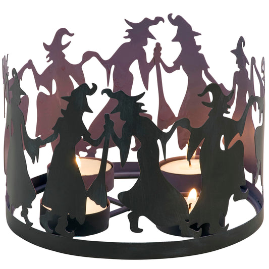 Primitives by Kathy Decorative Candle Holder, from Our Halloween Collection with Dimensional Design of Witch Shaped Metal Cutouts Surrounding 4 Metal Candle Holders, illuminates Dancing Witch Design