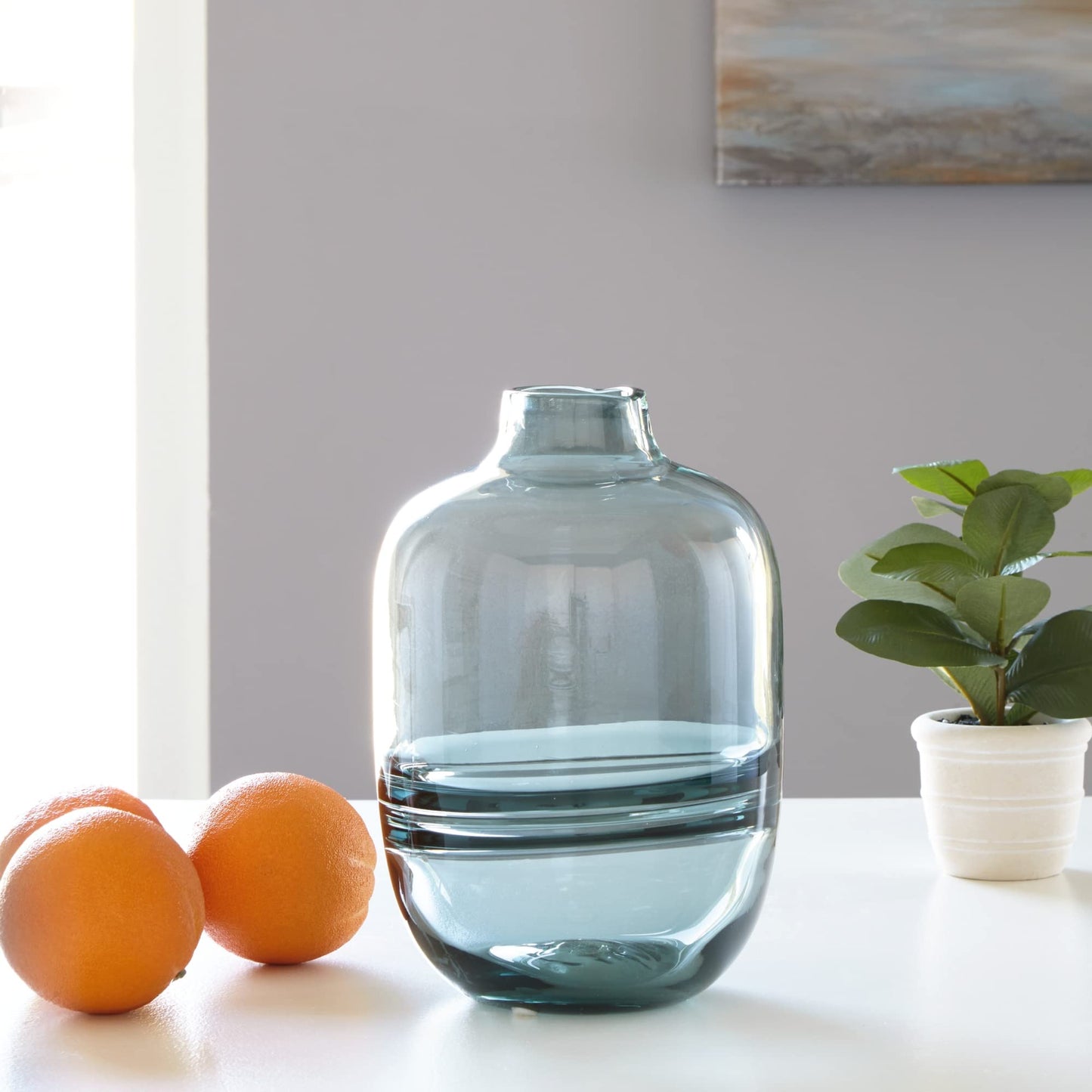 Signature Design by Ashley Lemmitt Teal Glass Vase, 10 Inch Watertight Decorative Bottle, Glass Construction for Contemporary Table Centerpieces, Transparent Blue